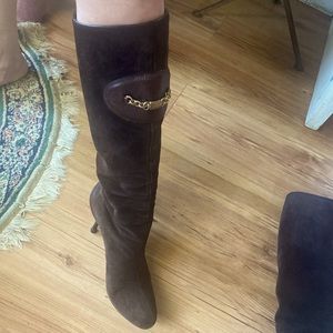 Gucci knee-high suede boots w:logo patch and chain. Two-inch, wood kitten heel.